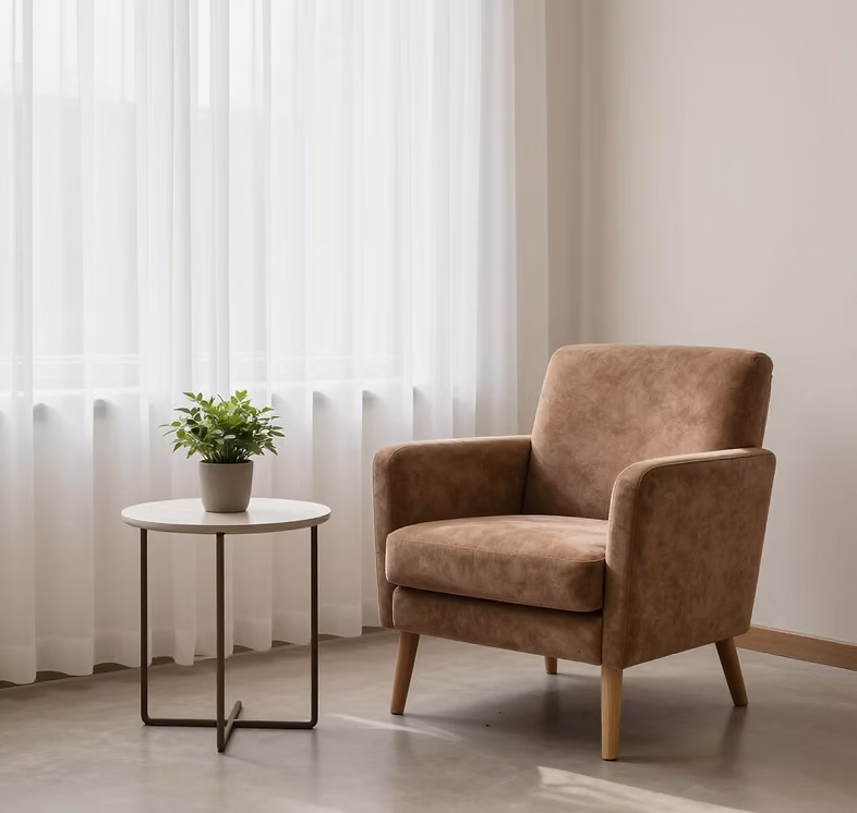 Comfortable therapy chair beside a small table for a private counselling session